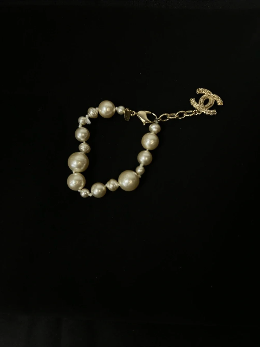 CHANEL Gold and Ivory Pearl Bracelet with CC Pendant